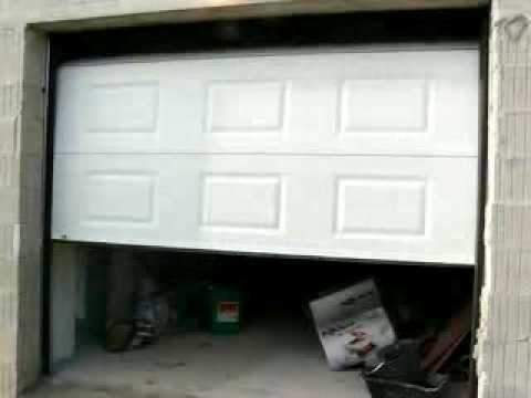 Porte de garage sectionnelle motorisée maguisa
